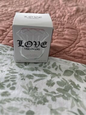 Vera Wang LOVE Fragrance Box on Pink Quilted Surface